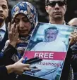  ??  ?? Tawakkol Karman holds a picture of missing Saudi writer Jamal Khashoggi. Picture: AP