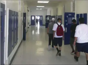  ?? PHOTO COURESTY OF ARNOLD PRECIADO ?? Students walk through the old office building during passing period at Central Union High School.