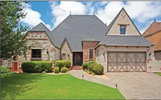  ??  ?? Multi-level home with english cottage charm on 3,565 square feet. Jim Koenigsede­r (479) 936-6703.