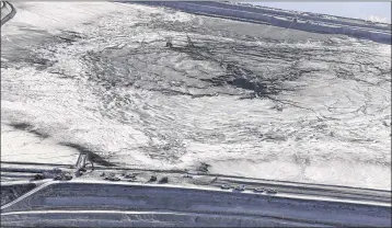  ?? CHRIS O’MEARA / AP ?? A large sinkhole on the Mosaic Co. property is shown in this aerial photo taken Thursday in Mulberry. The sinkhole is sending contaminat­ed water and fertilizer plant waste into Florida’s main drinking-water aquifer.