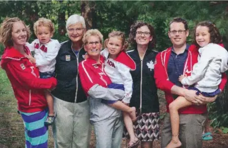  ??  ?? Premier Kathleen Wynne and her family sported some Canadian clothing from Hudson’s Bay Co. for her Christmas card. She’ll send out 48,000 this year.