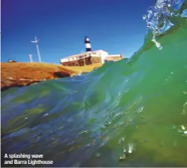  ??  ?? A splashing wave and Barra Lighthouse