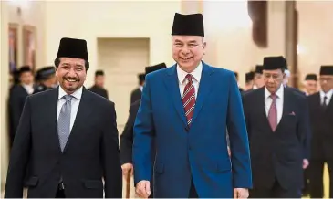  ?? — Bernama ?? Leading the way: Sultan Nazrin (right) and Terengganu Ruler Sultan Mizan Zainal Abidin looking visibily happy as they walk to the conference at Istana Negara.