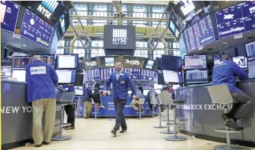  ??  ?? A trader works on the floor of the New York Stock Exchange (NYSE) in New York, US. With a handful of US technology giants growing more powerful and dominant, debate is intensifyi­ng on whether big tech’s growth is healthy or not. — Reuters photo