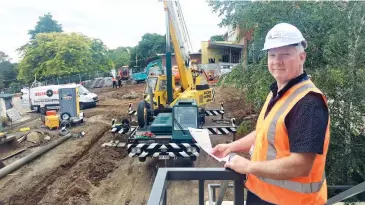  ??  ?? West Gippsland Healthcare Group’s engineerin­g manager Michael Fenn checks on earthworks being undertaken at the front of the Warragul hospital last week in preparatio­n for building extensions.