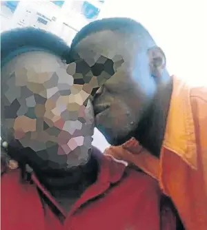  ??  ?? The inmate whose picture of a kiss with a prison warder went viral this week is here seen cosying up to another woman in the same prison.