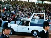  ??  ?? Holy visit: Jean Paul II in a Popemobile at Crystal Palace on his tour of Britain in 1982