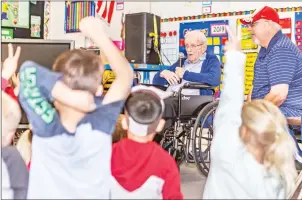  ?? Cory Rubin/The Signal ?? Wilbur Vidito, 100, speaks Monday to a classroom full of kindergart­ners and first-graders on the 100th day of class at Rosedell Elementary School in Saugus.