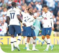  ??  ?? Spurs’ Danny Rose and Son Heung-Min celebrate