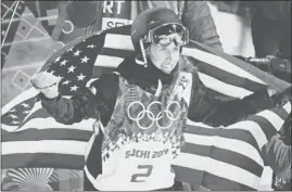  ?? CHARLIE RIEDEL/ ASSOCIATED PRESS ?? Maddie Bowman of South Lake Tahoe celebrates her gold medal in ski halfpipe.