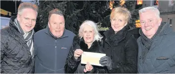  ??  ?? Christmas present Burnside in Bloom’s Lucille McNab (centre) received a cheque for the event from Tony Foster (left). Also in the picture are Malcolm Piggot, Caroline Kinnloch and Councillor Russell Clearie.