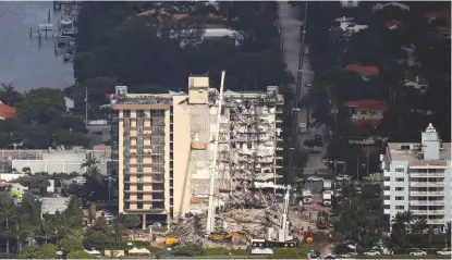  ?? (Marco Bello/Reuters) ?? RESCUERS WORK to sift through rubble at the partially collapsed residentia­l building in Surfside, Florida, earlier this week.