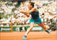  ?? Christophe Simon / Getty Images ?? Romania’s Simona Halep plays a backhand return to the United States’ Sloane Stephens during the French Open final on Saturday.