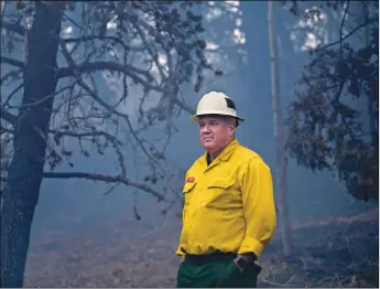  ?? MORGAN TIMMS/Taos News ?? Type 1 Operations Branch Director Corey Rose stands for a portrait Sunday (Oct. 25) near Bull Canyon in Branch 5 of the Luna Fire. Rose is also the assistant chief for LA City Fire and was assigned to help manage the Luna Fire through its progressiv­e containmen­t in recent days. ‘When you have this significan­t of a storm coming, you can’t wait until it hits you,’ Rose said of the impending snowstorm. ‘We’re pulling everyone off the hill.’ The Luna Fire management team has been using a combinatio­n of direct and indirect tactics on both sides of Luna Canyon to protect the values at risk and suppress the blaze, which as of Wednesday (Oct. 28), was 35 percent contained. ‘The people in this field have missed Christmase­s, birthdays, you name it,’ Rose said. ‘But what we get back is that reward for making that difference. That’s what keeps me going.’