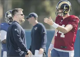  ?? Kyusung Gong Associated Press ?? ROB BORAS, with quarterbac­k Sean Mannion, was named interim offensive coordinato­r with four games left last season, and the Rams went 3-1.