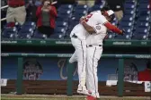  ?? ALEX BRANDON — THE ASSOCIATED PRESS ?? Washington Nationals’ Juan Soto, left, celebrates with manager Dave Martinez after Soto hit a game-winning single in the ninth inning against the Atlanta Braves on Tuesday in Washington.