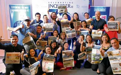  ?? —AUGUST DELA CRUZ ?? Inquirer president and CEO Sandy Prieto-Romualdez (front, center) celebrates with employees the paper’s 32 years of commitment to responsibl­e and truthful journalism.