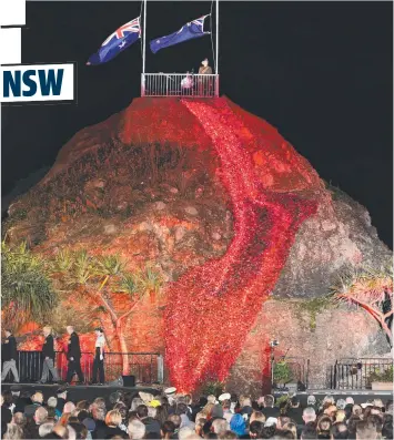  ??  ?? A crowd in the thousands turn out each year at the Currumbin RSL Dawn Service at Elephant Rock.