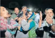  ?? AP PHOTO ?? ▪ Relatives and friends of Bukhari react in shock .