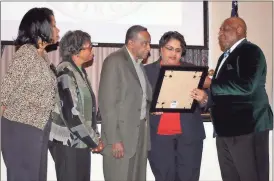  ?? Doug Walker / RN-T ?? Gail Veal (from left), Laney Stevenson, John Stevenson, Commission­er Sundai Stevenson and Commission­er Bill Collins participat­e in the reading of a proclamati­on honoring John Stevenson during a Black History Month observance in City Hall.