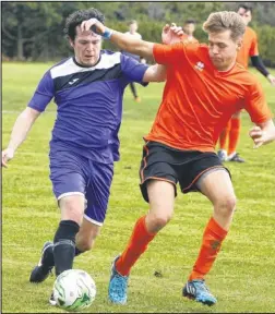  ?? Picture: Andy Jones FM4545292 ?? Fishermans Arms’ Ricky Comber takes on Park Royal’s Dan Melvin, orange