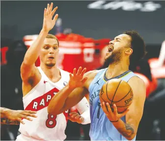  ?? KIM KLEMENT-USA TODAY SPORTS ?? Toronto Raptors guard Malachi Flynn, left, has emerged as one of the promising players on the team. With starters being rested, there has been more time available for rookie developmen­t.