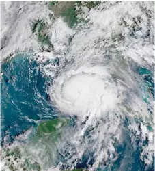  ?? — Reuters ?? Hurricane Michael is seen in this National Oceanic and Atmospheri­c Administra­tions’s Geostation­ary Operationa­l Environmen­tal Satellite (NOAA GOES-EAST satellite) image in the Gulf of Mexico on Tuesday.