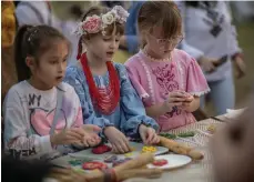  ?? Vidhyaa Chandramoh­an / The National ?? Above, children take part in a craft workshop; right, Sviatyi Mykolai, Ukraine’s Santa Claus