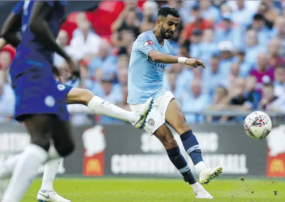  ?? IAN KINGTON/AFP/GETTY IMAGES ?? Defending champion Manchester City may have gotten even better in the off-season with the US$101-million transfer deal for Leicester City’s Riyad Mahrez.
