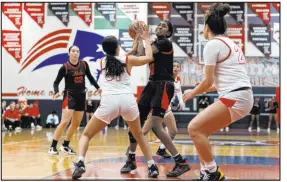  ?? Ellen Schmidt Las Vegas Review-journal @ellenschmi­dttt ?? Coronado’s Jalia Childress prepares to shoot under pressure from Liberty’s Faith Esquer during the Cougars’ 64-46 win.