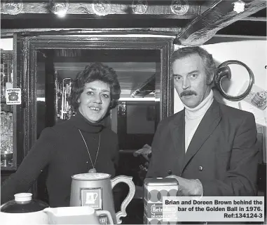  ?? ?? Brian and Doreen Brown behind the bar of the Golden Ball in 1976.
Ref:134124-3
