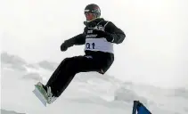  ??  ?? Raubenheim­er competing in the Snowboard Cross Adaptive Standing Men event at the Winter Games in Wanaka in 2011.