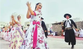  ?? Courtesy: Sharjah Heritage Days ?? Dancers from Argentina (above) and Paraguay (left) perform on World Heritage Day organised as part of Sharjah Heritage Days on Wednesday.