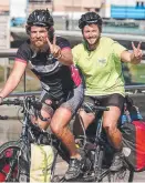  ?? Picture: AAP ?? Dr Snellgrove (right) with fellow doctor Lloyd Collier on their tandem charity bike ride.