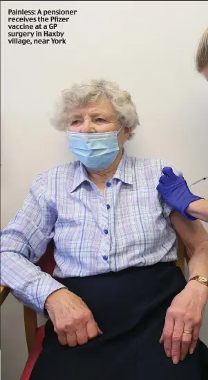  ??  ?? Painless: A pensioner receives the Pfizer vaccine at a GP surgery in Haxby village, near York