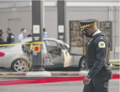  ?? ANTHONY VAZQUEZ/SUN-TIMES PHOTOS ?? Police investigat­e outside the McDonald’s on Sunday at the corner of West Roosevelt Road and South Kedzie Avenue where a 7-yearold girl was fatally shot and her father wounded.