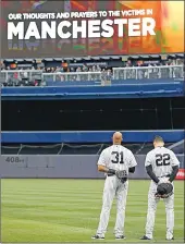  ?? Associated Press photos ?? New York Yankees outfielder­s Aaron Hicks (31) Jacoby Ellsbury (22) stand at attention as the British National Anthem is played prior to the baseball game against the Kansas City Royals at Yankee Stadium in New York on Tuesday.