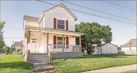  ?? CONTRIBUTE­D PHOTOS ?? The aluminum-and-vinyl sided home with four bedrooms has about 2,150 square feet of living space. The house is on a corner lotwith a wrap-around, covered front porch with updated railing.