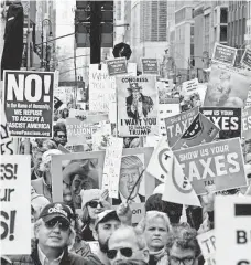  ?? SETH HARRISON, THE JOURNAL NEWS, VIA USA TODAY NETWORK ?? A Tax Day demonstrat­ion in New York, one of many around the country on Saturday.