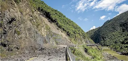  ?? PHOTO: GRANT MATTHEW/STUFF ?? Rocks the size of tyres block State Highway 3 through the Manawatu¯ Gorge.