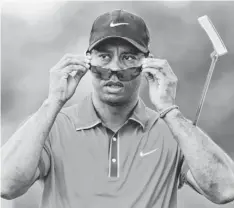  ?? ANDREW WEBER, USA TODAY SPORTS ?? Tiger Woods shot a 6-over 78 Sunday to fall out of contention in the World Golf Championsh­ips-Cadillac Championsh­ip.