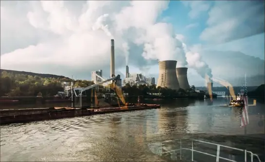  ?? Andrew Rush/Post-Gazette ?? The Bruce Mansfield coal power plant is seen through the windows of the Robert Dean Moore, a towboat, on the Ohio River in 2015. Plants like Mansfield, which shut down in 2019, will have to pay for their carbon dioxide emissions if Gov. Tom Wolf’s plan becomes the law.