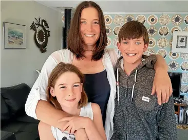  ??  ?? Charlotte Murray lives with her two children Evan Caulfield, 12, and Tessa Caulfield, 9, in a house bus in Leeston, but fears the local council will evict them.