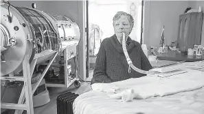  ?? Shelly Yang/Kansas City Star/ TNS ?? ■ Mona Randolph, 82, uses a respirator during the day to help her breathe. The modern device is not as comfortabl­e for her as the 75-year-old iron lung because it forces air into her lungs, which she describes as irritating. Randolph contracted polio when she was 20 years old and has suffered from post-polio syndrome since her 40s.