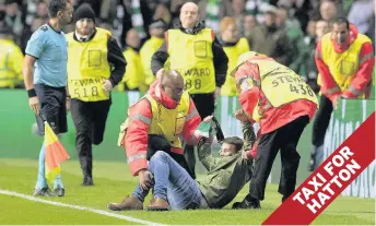  ??  ?? STUPOR-SUB The muppet is decked on sidelines as stewards rush in to take control of the situation