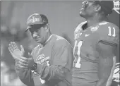  ?? MIKE MCCARN/AP ?? Clemson head coach Dabo Swinney, left, celebrates following the Atlantic Coast Conference championsh­ip on Dec. 7.