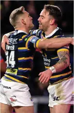  ??  ?? EASY: Myler celebrates try with Dwyer