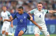  ?? CHARLES PLATIAU / REUTERS ?? France’s Kylian Mbappe in action against England’s Phil Jones in Tuesday’s friendly.