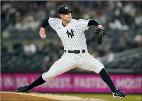  ?? JOHN MINCHILLO - THE ASSOCIATED PRESS ?? FILE - New York Yankees starting pitcher Corey Kluber throws during the first inning of the team’s baseball game against the Cleveland Indians, Friday, Sept. 17, 2021, in New York.