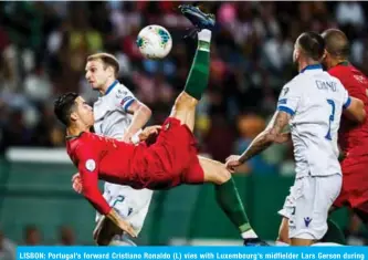 ?? AFP ?? LISBON: Portugal’s forward Cristiano Ronaldo (L) vies with Luxembourg’s midfielder Lars Gerson during the Euro 2020 qualifier football match between Portugal and Luxembourg at the Jose Alvalade stadium in Lisbon. —